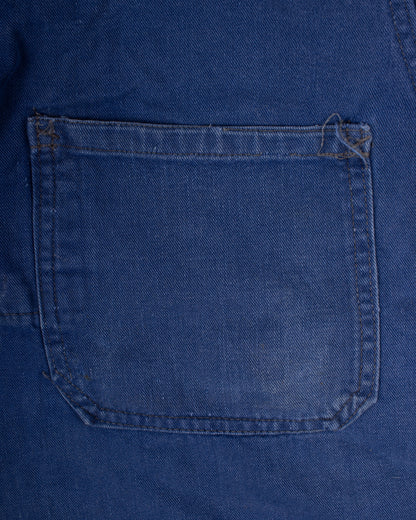 Close-up of a blue denim pocket on a garment french blue vareuse fisherman marin sailor sailing blouse smoke smock jacket overshirt 1960s