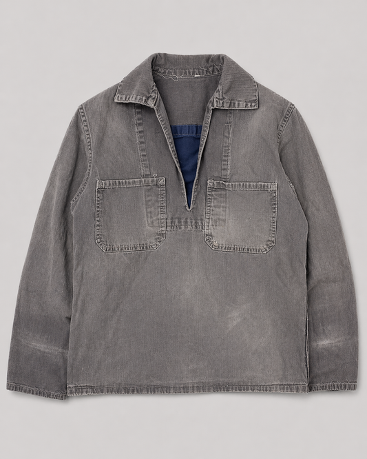 Gray cotton shirt with collar on a light gray background french blue vareuse fisherman marin sailor sailing blouse smoke smock jacket overshirt 1960s