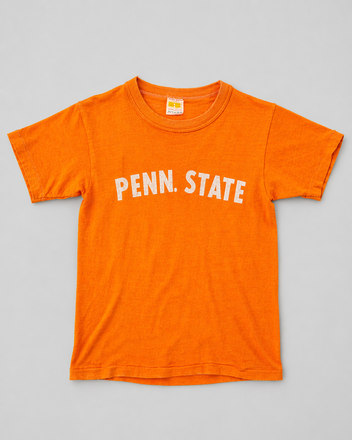Orange t-shirt with 'PENN. STATE' text on a gray background single stitch I Love NY I love new york college tee harvard university highschool printed t-shirt 1970s 70s baby tee crop t-shirt vintage cropped tee Russel